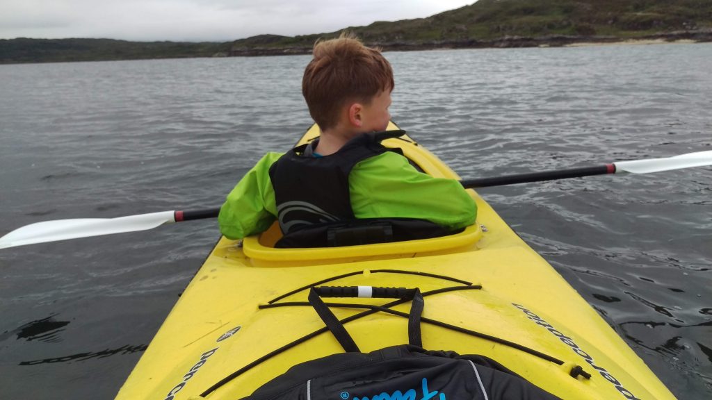 Reuben, aged 7, Sea Kayaking while staying at Reuben's Highland Retreat Self Catering Lodges