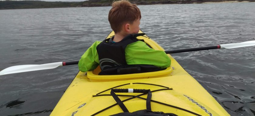 Reuben, aged 7, Sea Kayaking while staying at Reuben's Highland Retreat Self Catering Lodges